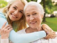 Mother and daughter together facing the camera