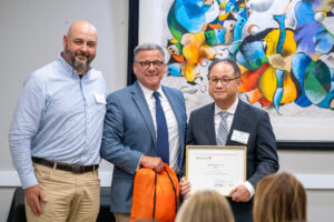 Joseph Song, Senior Bus Intel Developer (right) with Tim Haspert, Vice President & Chief Information Officer and Dan Fagin, President & Chief Executive Officer