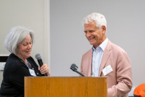 2026 Annual Meeting, Susan & Ken at Podium 2026 Annual Meeting, Susan & Ken at Podium